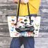 Two cute pandas hugging surrounded colorful hearts leather tote bag