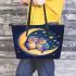 Two owls in love sitting on the crescent moon leather tote bag