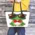 Vector cartoon of green frog wearing sunglasses and red bow tie leaather tote bag