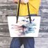 Watercolor dragonfly sitting on flower leather tote bag