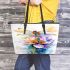 Watercolor dragonfly sitting on flower leather tote bag