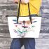 Watercolor dragonfly sitting on flower leather tote bag