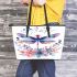Watercolor dragonfly surrounded in the style of flowers leather tote bag