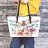 Watercolor dragonfly surrounded in the style of flowers leather tote bag