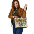 Abstract dragonfly with swirls and flowers leather tote bag