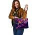 An artistic illustration of a frog in vibrant colors leaather tote bag