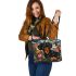 Black and tan dachshund dog surrounded by colorful tulips leather tote bag