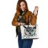 Black and white owl with teal highlights leather tote bag