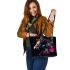 Black background with a colorful horse leather tote bag