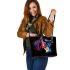 Black background with a colorful horse leather tote bag