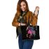Black background with a colorful horse leather tote bag