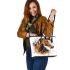 Brown horse with white and black feathers on its head leather tote bag