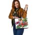 Colorful cartoon tree frog with lily flower leaather tote bag