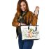 Cute bunny sitting on top of an carrot hello spring leather tote bag