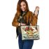 Cute cartoon frog eating ramen shown in a full body shot leaather tote bag