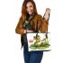 Cute cartoon frog sitting on a lily pad smiling with his legs crossed leaather tote bag