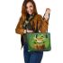 Cute cartoon frog sitting on a tree stump leaather tote bag