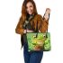 Cute cartoon frog sitting on a tree stump leaather tote bag
