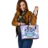 Cute cartoon owl with big eyes wearing an oversized sweater leather tote bag