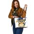 Cute cartoon owl with glasses and graduation hat holding book leather tote bag