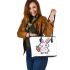 Cute cartoon rabbit holding a carrot in a simple leather tote bag