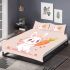 Cute cartoon rabbit is playing with an orange carrot bedding set