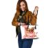 Cute chihuahua puppy inside a pink teacup with valentine candy leather tote bag