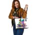 Cute colorful frog sitting on water leaather tote bag