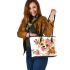 Cute corgi puppy with pink roses in her hair and butterflies leather tote bag