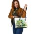 Cute frog sitting on the grass with flowers leaather tote bag