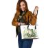 Cute frog sitting on the ground with flowers leaather tote bag