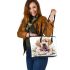 Cute golden retriever puppy with daisies and easter eggs leather tote bag