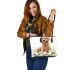 Cute golden retriever with easter eggs and white daisies leather tote bag