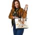 Cute little yorkshire terrier with long hair and bows in her ears leather tote bag