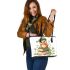Cute owl wearing a green beret sitting on books leather tote bag