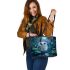 Cute owl with big blue eyes perched leather tote bag