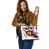 Cute owl with big eyes colorful feathers and beautiful wings perched leather tote bag