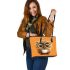 Cute owl with big eyes holding a white coffee cup leather tote bag