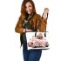 Cute pink car with a cute puppy wearing a bow on its head leather tote bag