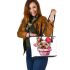 Cute pink yorkshire terrier in a cupcake leather tote bag