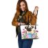 Cute pug dog inside a flower bucket leather tote bag