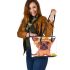 Cute yorkshire terrier wearing summer leather tote bag