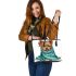 Cute yorkshire terrier wrapped in teal blanket leather tote bag