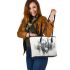 Ethereal deer with large antlers standing in the middle leather totee bag