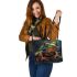 Illustrative colorful frog with fractal skin and glowing eyes leaather tote bag