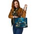 Owl siting on top books leather tote bag