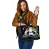 Panda with black and white fur and colorful floral leather tote bag