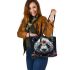 Panda with black and white fur and colorful floral leather tote bag