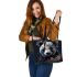 Panda with black and white fur and colorful floral leather tote bag