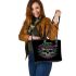 Skull with green frog on top and purple thistles growing leaather tote bag